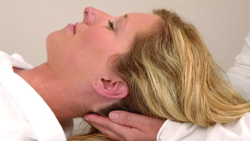 Woman receiving Craniosacral therapy